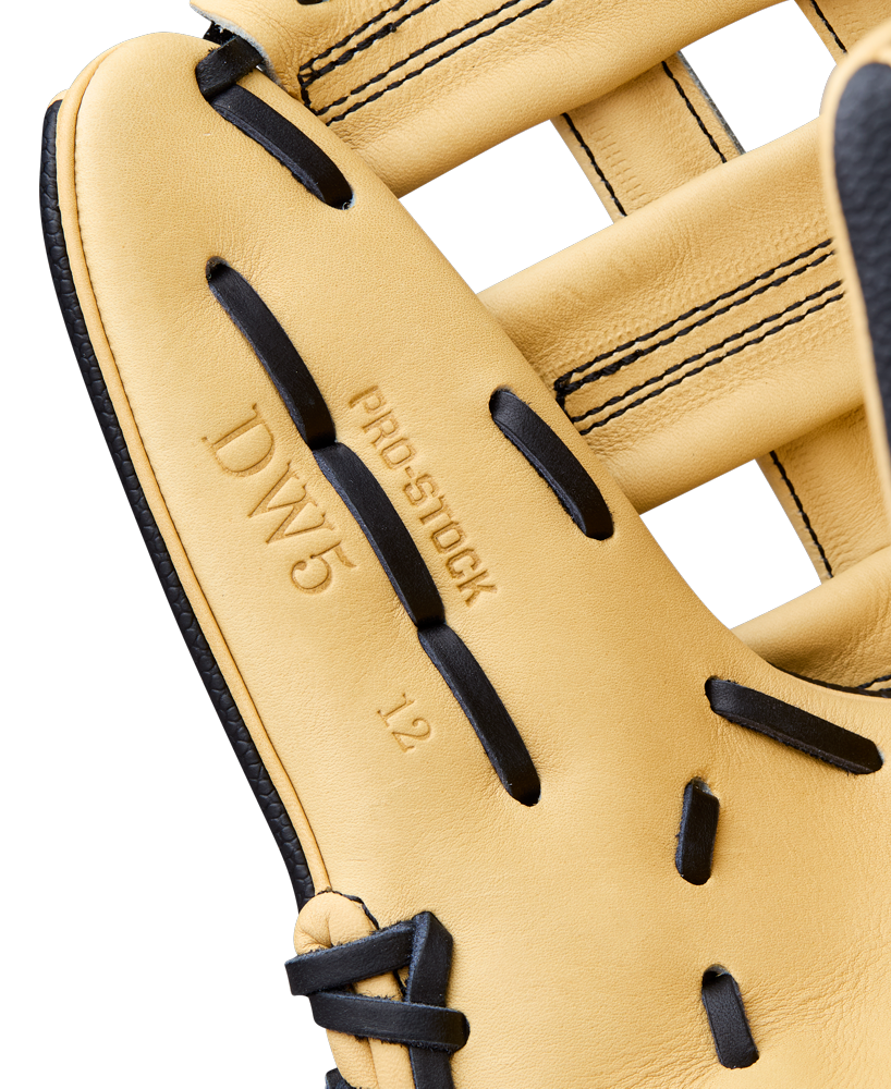 Close-up of a Wilson A2000 DW5 12" Baseball Glove (model WBW10411612) in tan with black laces, featuring "PRO STOCK," "DW5," and "12" embossed on the Pro Stock Leather near the pocket.