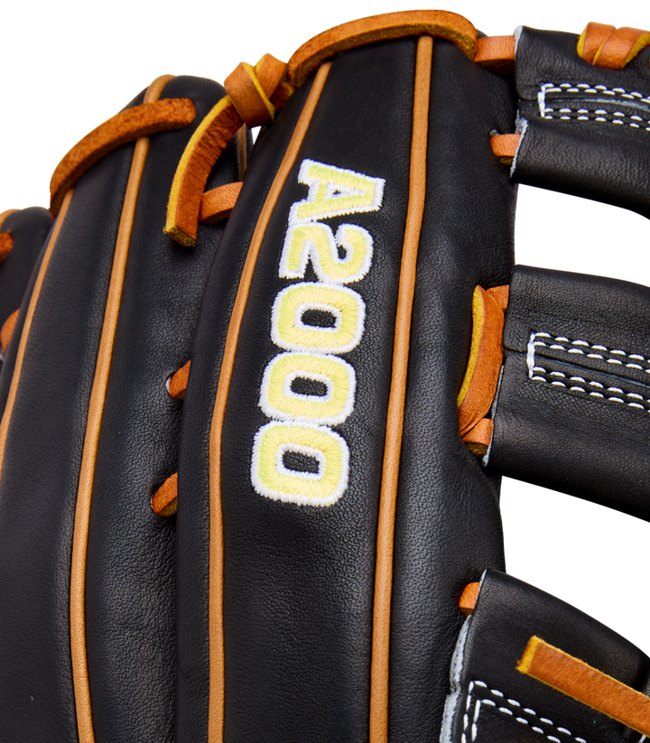 Close-up of the Wilson A2000 1750 12.5" Baseball Glove (WBW104121125), a black outfield glove with brown laces, white stitching, and "A2000" embroidered in white with yellow outlining, crafted from Pro Stock leather.