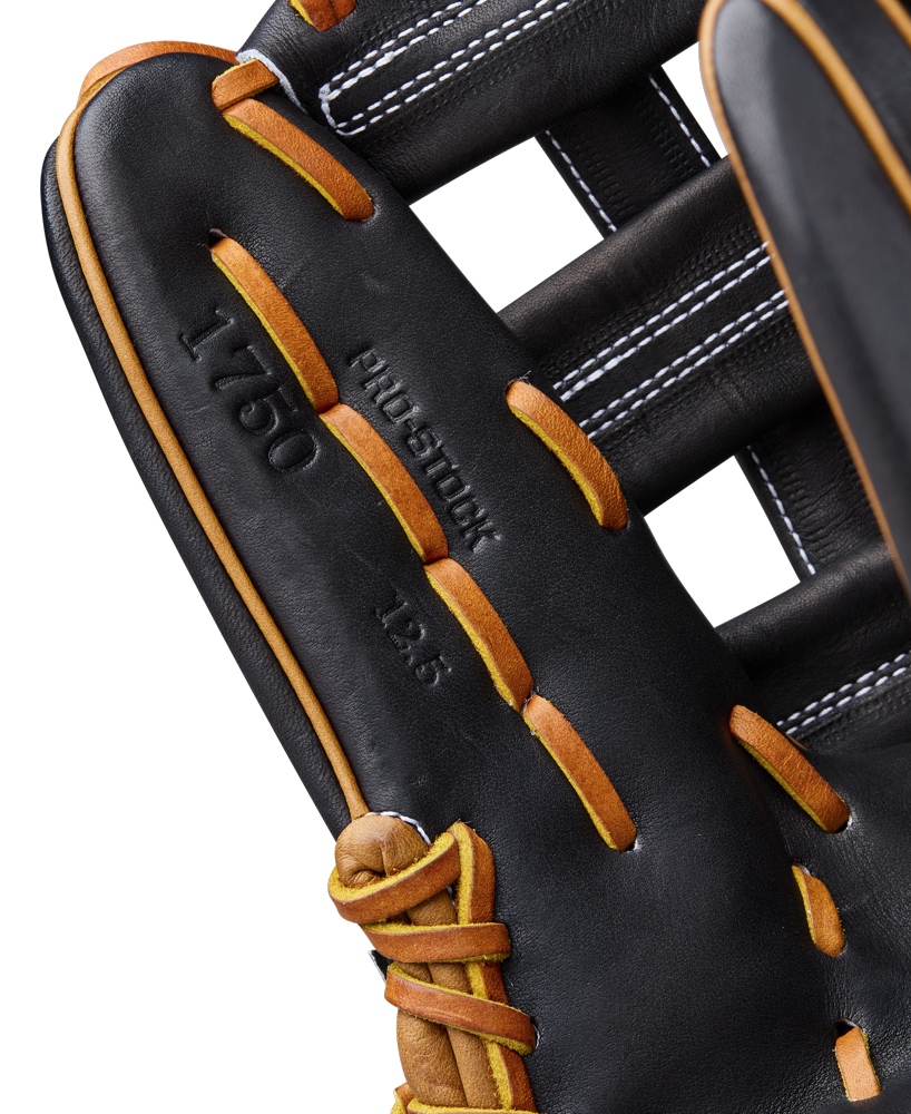 Close-up of the Wilson A2000 1750 12.5" Baseball Glove (WBW104121125), crafted from Pro Stock leather in black and brown, with detailed stitching, laces, and embossed A2000 markings from the Classics Series.