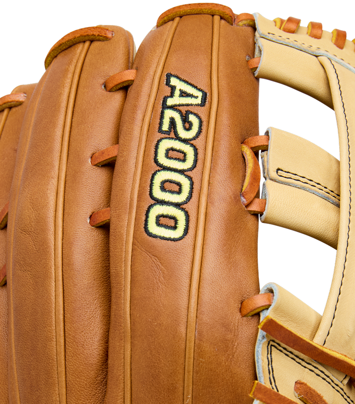 Close-up of a Wilson A2000 1777 12.75" Baseball Glove (WBW1041251275), featuring brown Pro Stock Leather, yellow and black A2000 stitching, plus tan and cream lacing and accents.