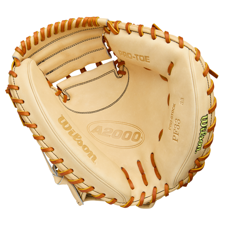 A Wilson A2000 PF33 33" Catcher's Mitt by Wilson, crafted from Pro Stock Leather with brown laces and PRO-TOE labels, is shown from above to highlight its deep pocket and wide webbing.