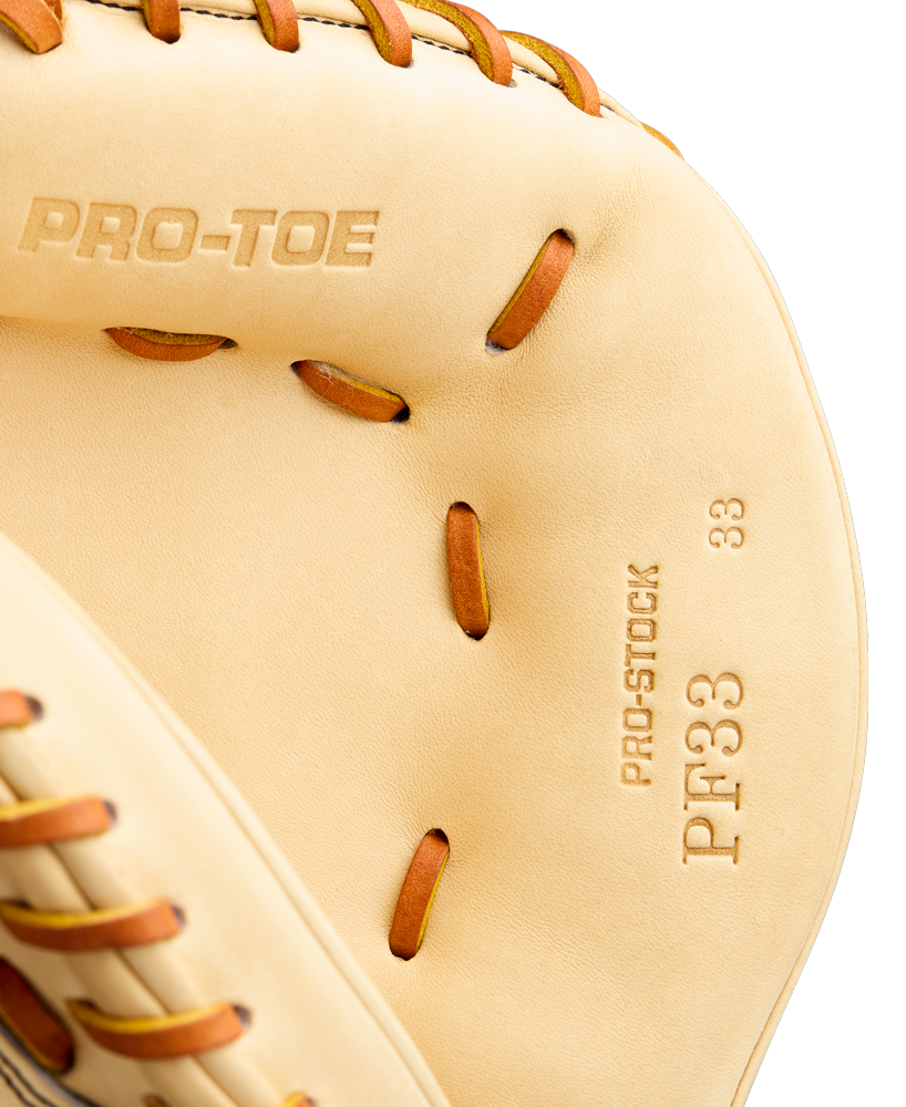 Close-up of a tan Wilson A2000 PF33 33" Baseball Catcher's Mitt (WBW10412733) with brown leather lacing, featuring PRO-TOE and PRO-STOCK PF33 33" stamped on the inside.