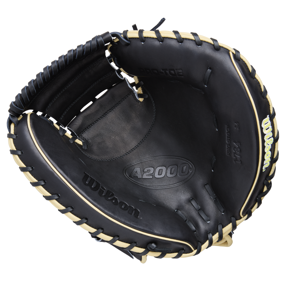 The Wilson A2000 1734 34" Baseball Catcher's Mitt (WBW10412834) features black Pro Stock Leather with tan lacing, visible Wilson and A2000 branding, an open design, and a deep, padded pocket for catchers.