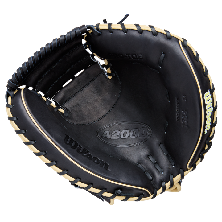 The Wilson A2000 1734 34" Baseball Catcher's Mitt (WBW10412834) features black Pro Stock Leather with tan lacing, visible Wilson and A2000 branding, an open design, and a deep, padded pocket for catchers.