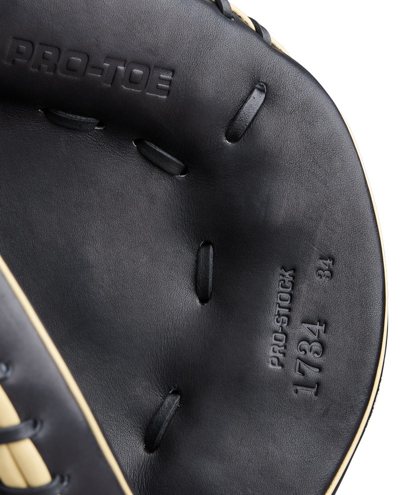 Close-up of the Wilson A2000 1734 34" Catcher's Mitt (WBW10412834) in black, showing detailed stitching and embossed text, highlighting Wilson’s authentic Pro Stock Leather craftsmanship.