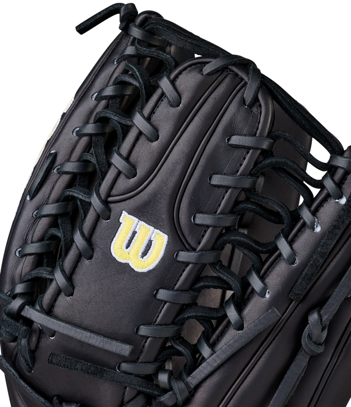 Close-up of the Wilson A2000 OT7 12.75" baseball glove (WBW1041811275), crafted from Pro Stock Leather with black laces and a yellow W logo.