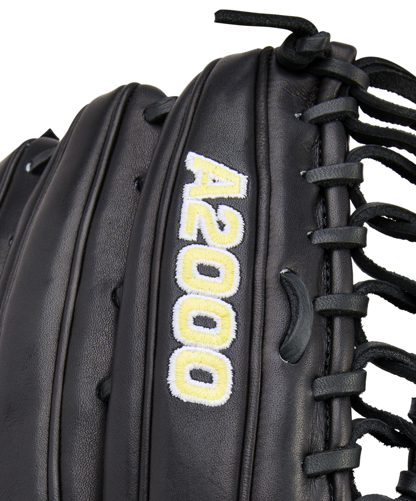 Close-up of a black Wilson A2000 OT7 12.75" Baseball Glove (WBW1041811275) featuring "A2000" embroidered in yellow and white near the laces.