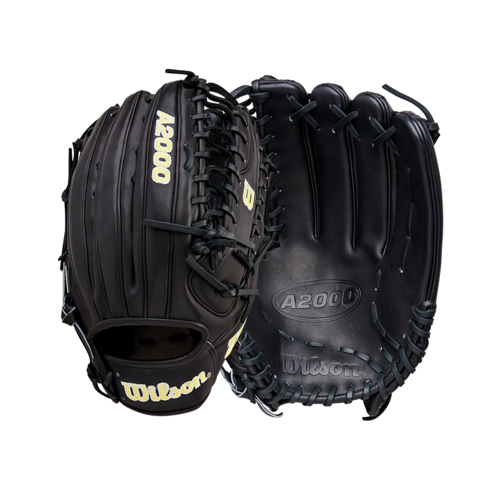 Two black Wilson A2000 OT7 12.75" baseball gloves (WBW1041811275) are shown, one with the palm visible and the other the back, both featuring lacing, gold Wilson branding, and durable Pro Stock Leather construction.