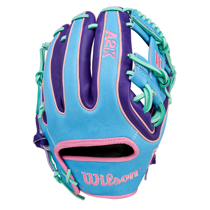 The Wilson A2K 1720 11.5" Baseball Glove - GOTM October 2025 (WBW104220115) features light blue, purple, and teal with pink accents, Pro Stock Select leather, and "Wilson" embroidered near the wrist on the back.