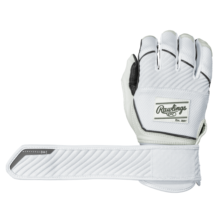 A pair of Rawlings Workhorse OKC Compression Strap Women's Batting Gloves is displayedâone glove palm down, the other showing the underside and its extended compression strap labeled WORKHORSE OKC. The gloves are white with black trim.