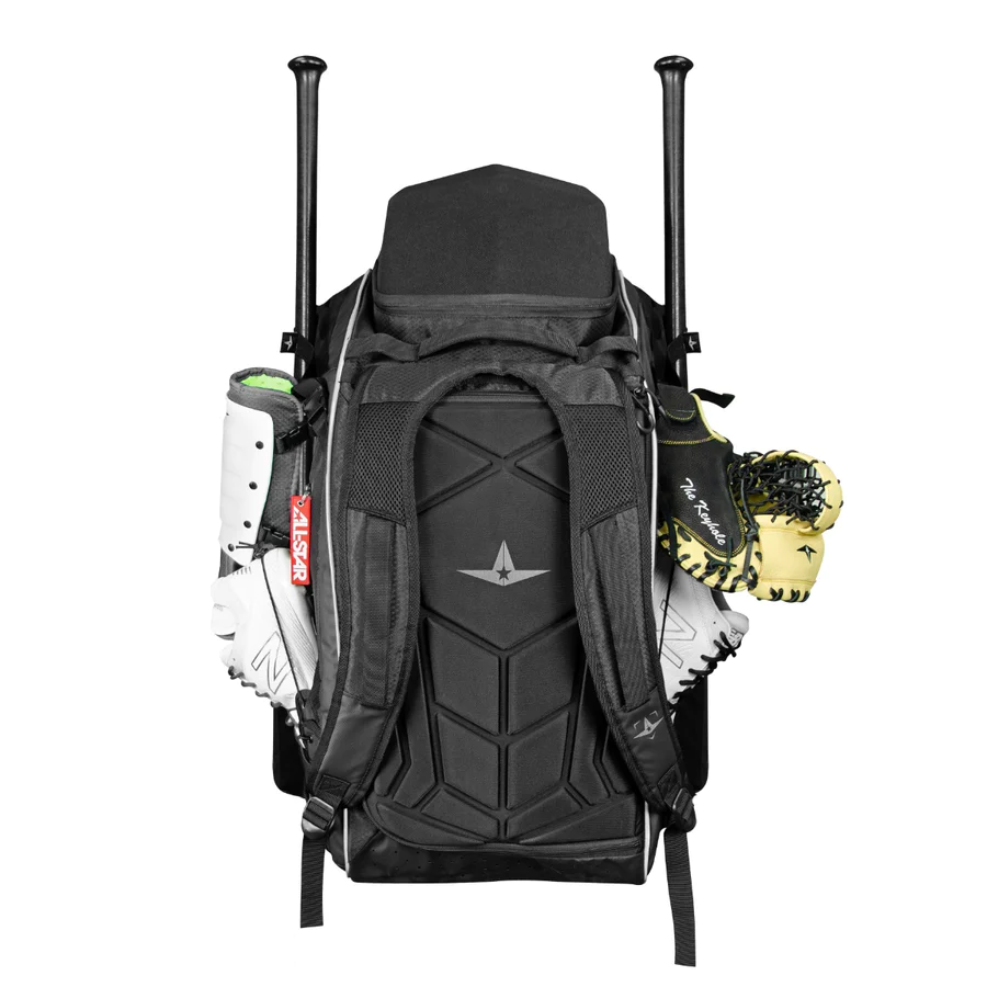A black baseball backpack with two bats sticking out from the sides, a pair of white cleats attached to one side, and two baseball glovesāone white and one yellowāattached to the other side.