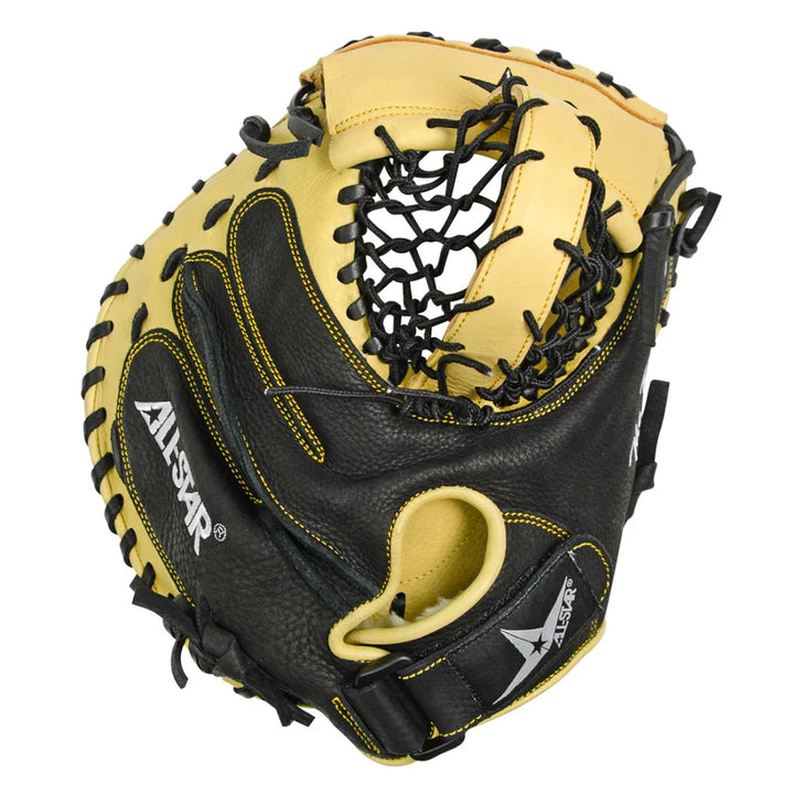 The All Star KEYHOLE 33.5" Training Mitt: CM4000TM is a black and tan catcher’s mitt with yellow stitching, All Star logos on thumb and wrist, leather laces, an open web, and is designed to enhance pocket awareness during training.