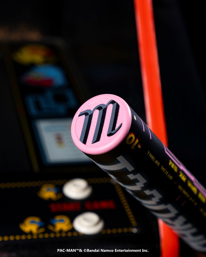 A close-up of the 2027 Marucci ASURA Rise PAC-MAN (-10) Fastpitch Softball Bat by Marucci, featuring a pink top with a black "m"—a must-have for any PAC-MAN Collection fan.