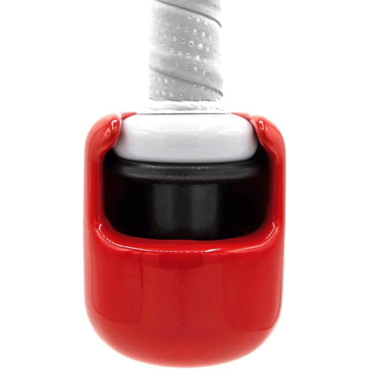 Close-up of a tennis racket handle with a red vibration dampener and white grip tapeāsimilar in function to the Hitting Knob Bat Weight by Hitting Knob, which is designed to improve control and bat speed for baseball players.