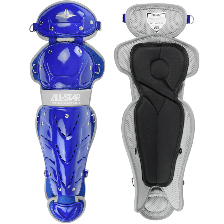 Two All Star Top Star Catcher's Leg Guards (LG-TS) are shown: the left displays a shiny blue and silver shell, while the right shows the soft, padded gray and black interior. Double-knee design enhances protection for youth players.
