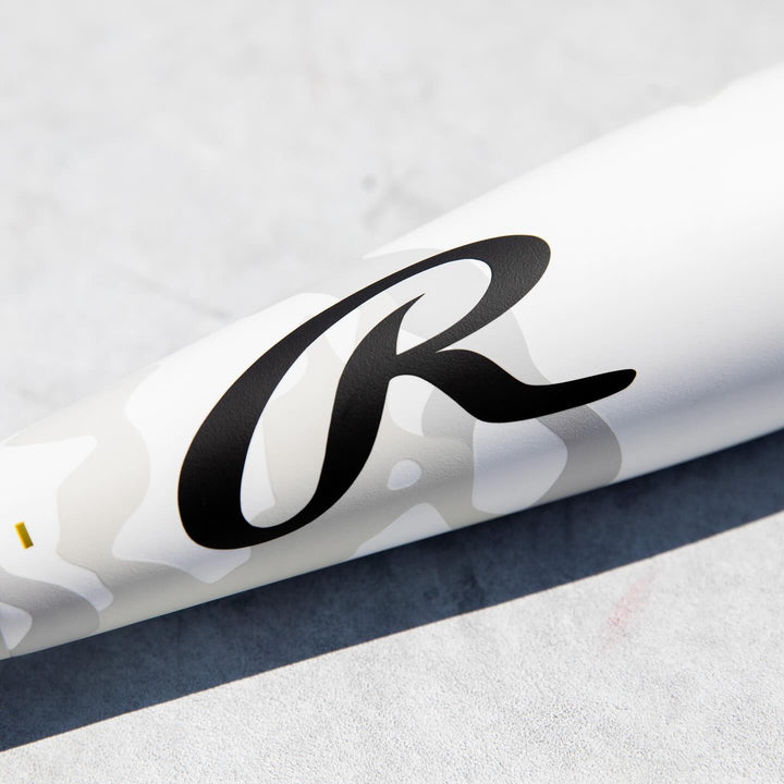 A white Rawlings 2025 Icon (-5) USSSA baseball bat (2 3/4", RUT5I5) with black lettering.