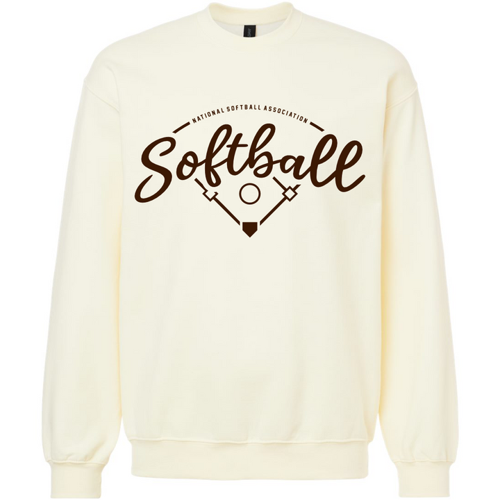 The DSG Apparel NSA Vintage Softball Crewneck Sweatshirt features a cream color, brown "Softball" and "National Softball Association" script, a simple field graphic with bases and bats, and is made from soft ring spun cotton.