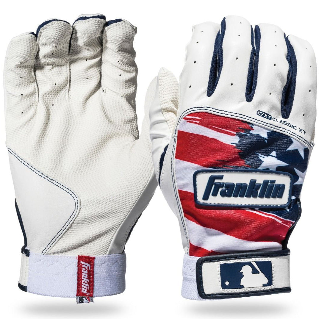 Two Franklin Classic XT Adult Batting Gloves: the left shows a white palm for superior grip, while the right features a red, white, and blue U.S. flag-inspired back with an MLB logo near the wrist. Ideal for adult hitters.
