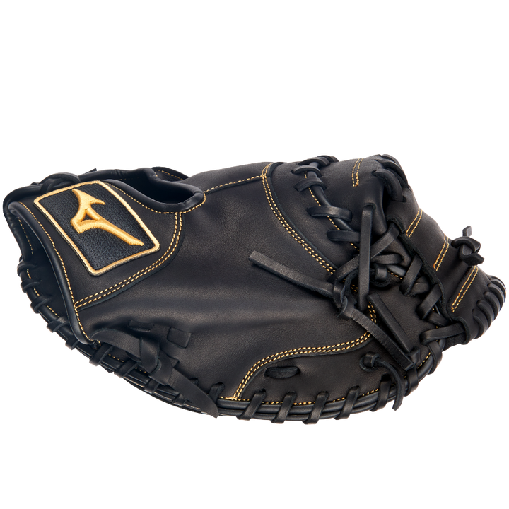 A Mizuno MVP Prime 34" GXC50PB4 catcher's mitt by Mizuno, crafted from Bio Soft Leather in black with tan stitching and a yellow logo patch on the wrist, is displayed against a plain white background.