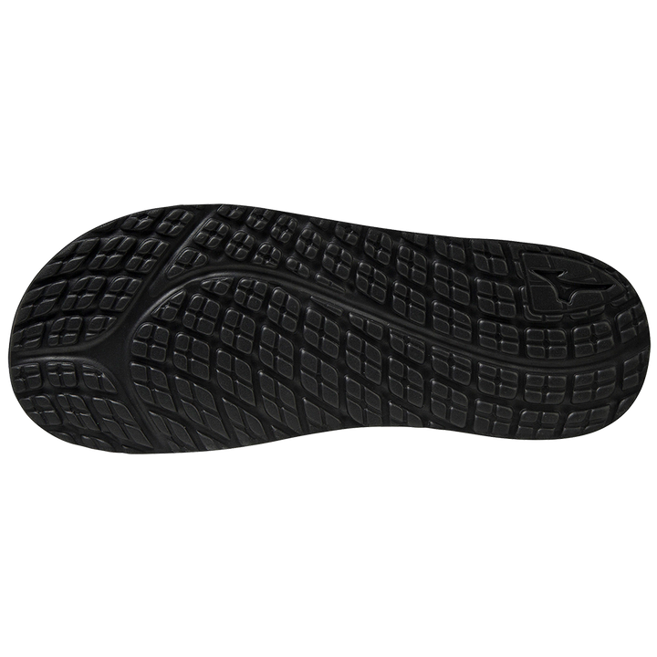 The image shows the Mizuno Relax Slide 2 Adult Slides (320629) by Mizuno, featuring a black rubber outsole with textured, grid-like tread and curved grooves for grip, plus a cushioned EVA midsole for comfort and support.