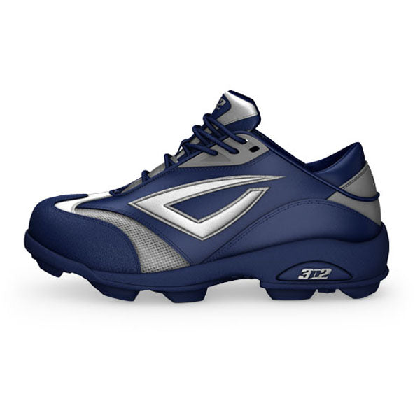 The 3n2 Accelerate Fastpitch Molded Cleats (ACCEL-FP) by 3n2 are navy blue and gray women's softball cleats with a chunky sole, silver accents, and β312β near the heelβideal for stylish support on the field.