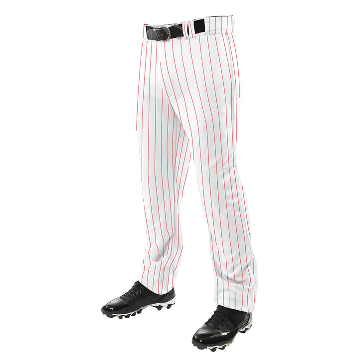 A person is wearing Champro Sports Youth Triple Crown Pinstripe Open Bottom Baseball Pants (BPPINY), made of abrasion-resistant pro-warp polyester with thin red vertical stripes, along with a black belt and black cleats. Upper body not visible.