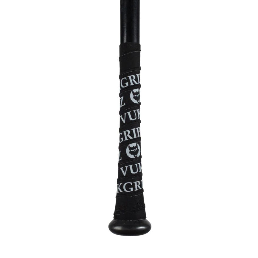 Close-up of a VukGripz Bat Grip Tape-wrapped black bat handle, featuring repeating white "VukGripz" text and wolf head logo for superior grip.