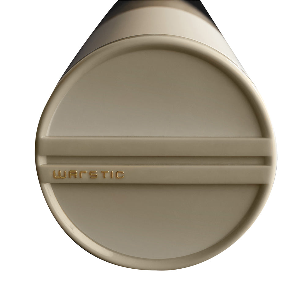 Close-up of the knob end of a beige 2023 Warstic Bonesaber (-3) BBCOR Baseball Bat (MBBSR23WH3), featuring "WARSTIC" engraved in gold near the edge, set against a white background.