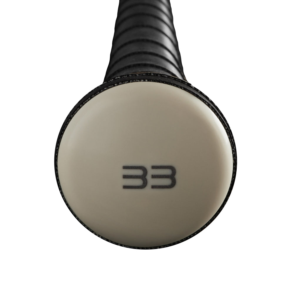 Close-up of the knob on the 2023 Warstic Bonesaber (-3) BBCOR Baseball Bat (MBBSR23WH3), featuring the number 33 in black on a light end cap and a handle wrapped in black grip tape from Warstic’s Bonesaber lineup.