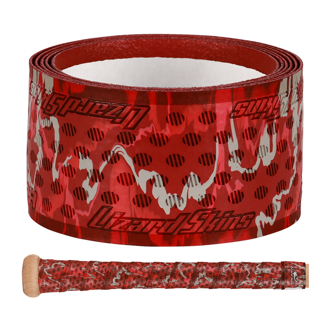 A roll of Lizard Skins DSP Ultra Camo 1.1mm Bat Grip is shown above a bat handle wrapped with the same red, black, and white camouflage-patterned grip, featuring the Lizard Skins logo.