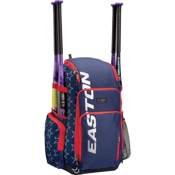 An Easton Roadhouse Backpack (EBA004) in blue and red with white stars on the side pocket, featuring two purple and black slowpitch bats in holders, and a mesh water bottle pocket on the right side.