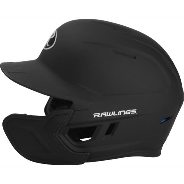 A side view of the Rawlings Mach Matte Batting Helmet with EXT Flap (MACHEXT) in matte black, featuring a protective face guard, ventilation slits, and visible Rawlings logos on the side and brim.