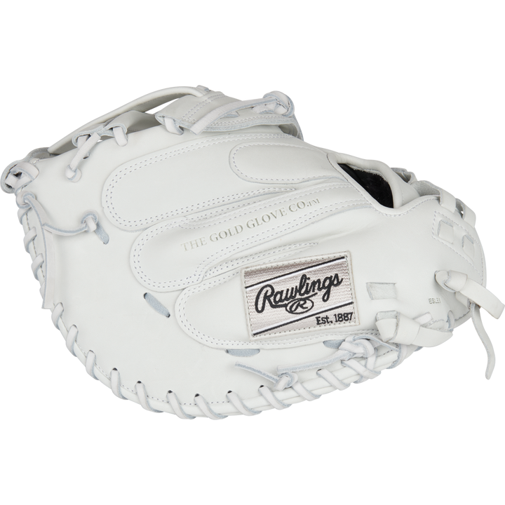 A white Rawlings Liberty Advanced 34" Fastpitch Catcher's Mitt (RLACM34W) with silver laces, THE GOLD GLOVE CO. embossed on the palm, and a Rawlings patch marked Est. 1887 on the back.