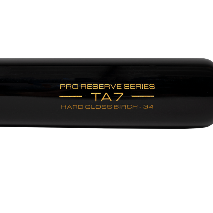 Close-up of a Victus TA7 Tim Anderson Pro Reserve Birch Wood Bat (VRWBTA7-NT/BK) in sleek black, showcasing Big League-grade quality and gold text: PRO RESERVE SERIES TA7 HARD GLOSS BIRCH - 34 on the barrel.