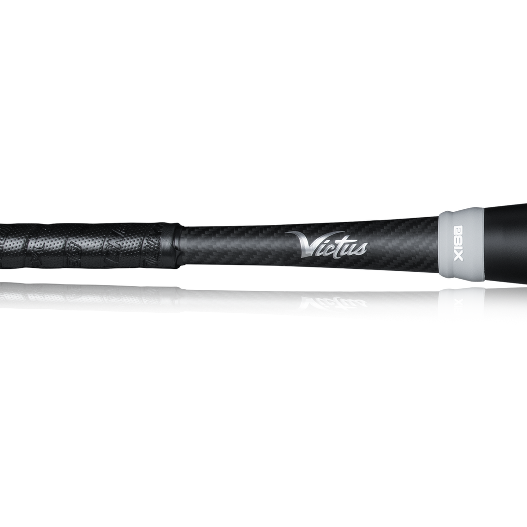 Close-up of a black 2023 Victus NOX 2 (-8) USSSA Baseball Bat handle with textured grip and âVictusâ in white script, highlighting this two-piece hybrid bat (model VSBN2X8) against a plain white background.