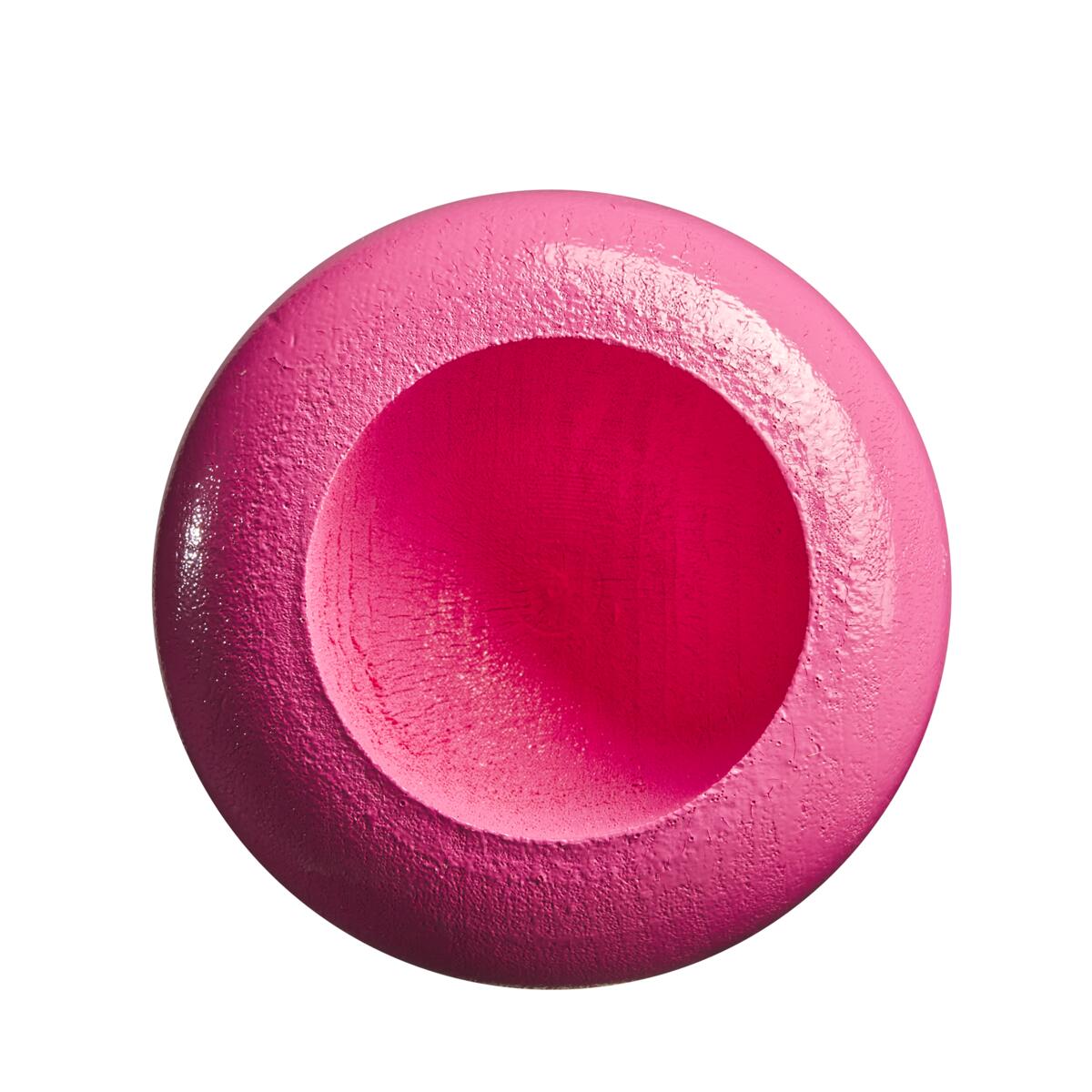 A bright pink, round object with a smooth center and textured edges, evocative of the balanced swing of the Louisville Slugger Genuine MIX Pink Wood Baseball Bat (WBL2691010), is photographed against a white background.