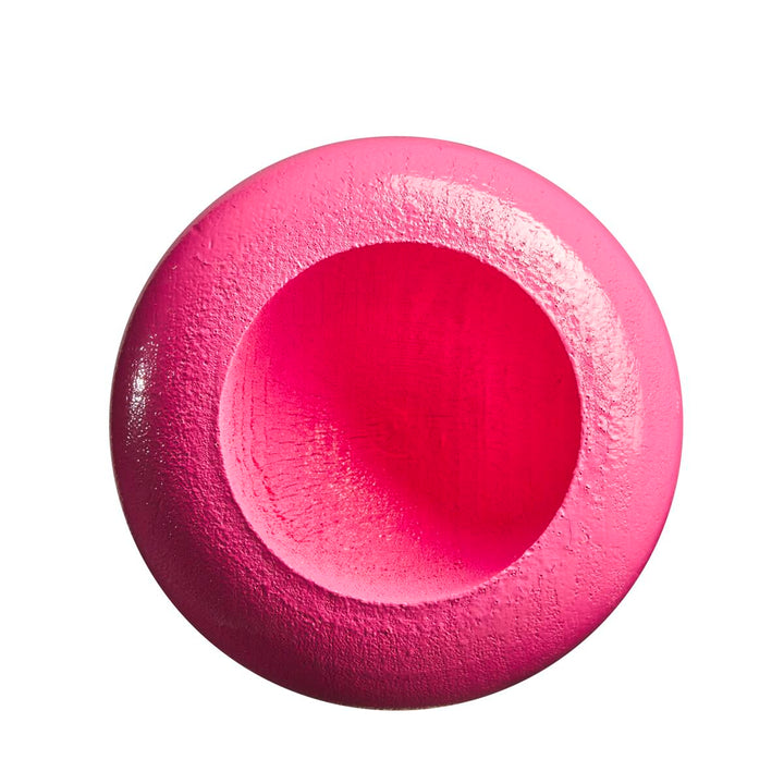 A bright pink, round object with a smooth center and textured edges, evocative of the balanced swing of the Louisville Slugger Genuine MIX Pink Wood Baseball Bat (WBL2691010), is photographed against a white background.