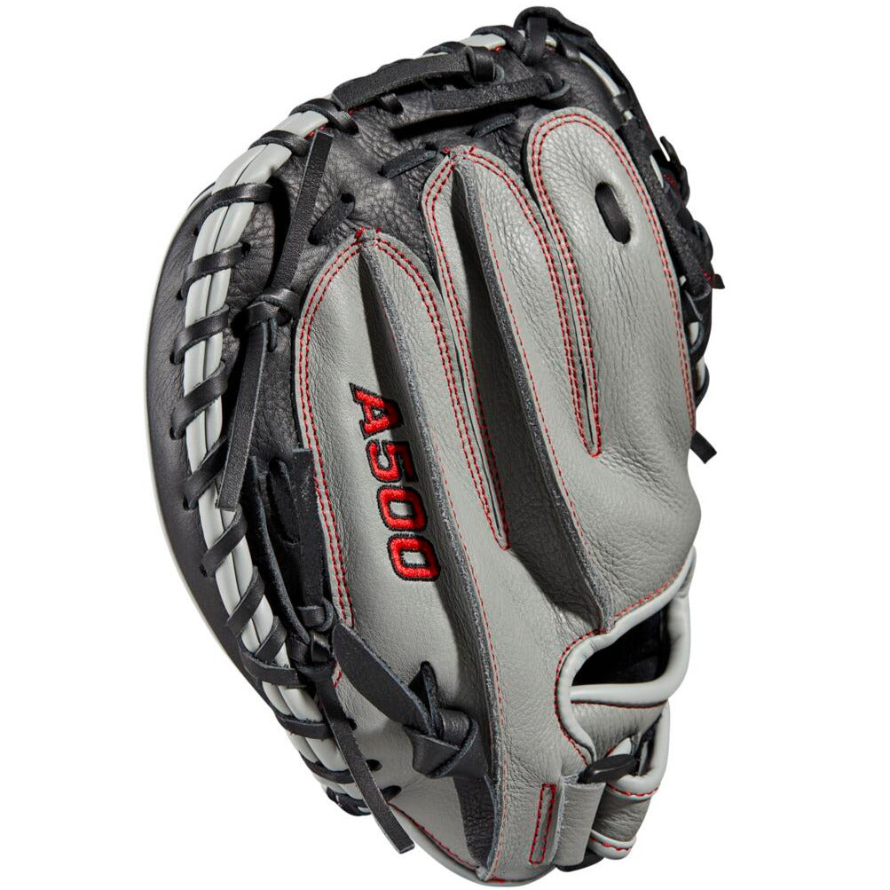A close-up of the Wilson A500 32" youth baseball catcher's mitt (model WBW10090732), featuring gray and black top grain leather, red stitching, an adjustable wrist closure, and the Wilson logo embroidered on the side.