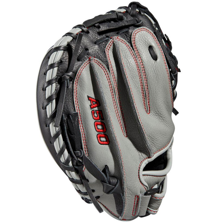 A close-up of the Wilson A500 32" youth baseball catcher's mitt (model WBW10090732), featuring gray and black top grain leather, red stitching, an adjustable wrist closure, and the Wilson logo embroidered on the side.