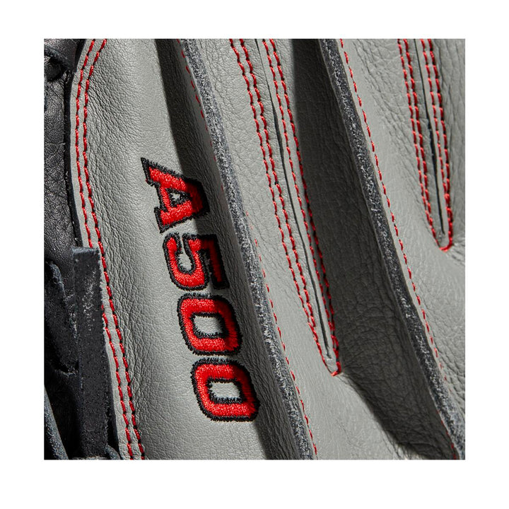 Close-up of the Wilson A500 32" Baseball Catcher's Mitt (WBW10090732), a gray top grain leather youth mitt with red stitching, adjustable wrist closure, and A500 embroidered in red and black.