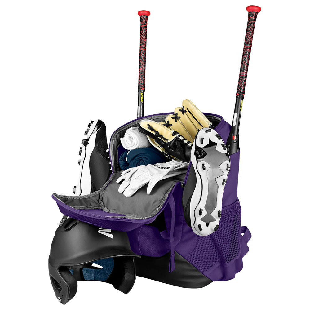 The Easton Walk Off NX Backpack by Easton, shown open in purple, holds cleats, gloves, clothes, socks, and gear. Two bats protrude from the back of the bag while a black helmet sits next to it.