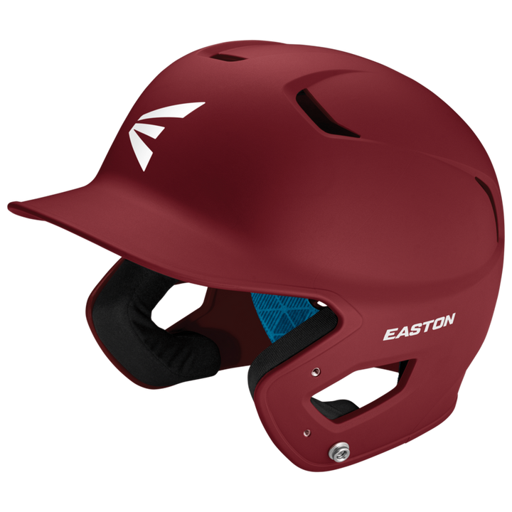 The Easton Z5 2.0 Grip Matte Solid Batting Helmet (Z52MT) in maroon features ear protection, ventilation holes, visible interior padding, white EASTON and E logos, and is NOCSAE certified for safety.