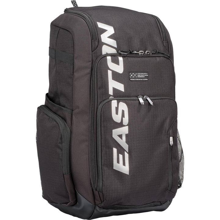 The Easton Roadhouse Backpack (EBA004) is a black Easton backpack featuring multiple zippered compartments, side pockets, and the EASTON brand name printed vertically in large white letters on the front.