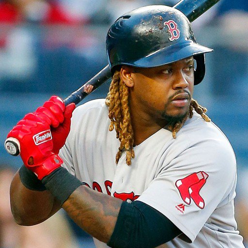 A Boston Red Sox player with dreadlocks and a beard, wearing a helmet and Franklin CFX Pro Full Color Chrome Adult Batting Gloves by Franklin, prepares to bat during a game for superior grip.