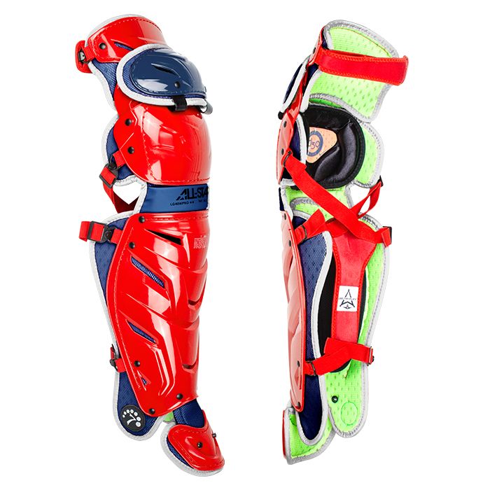 All Star System7 Axis Catcher's Leg Guards (LG912S7X/LG1216S7X/LG40SPRO/LG40WPRO) in bright red with black, blue, and green padding, adjustable red straps, and the advanced LINQ hinge system. Shown front and side on white.