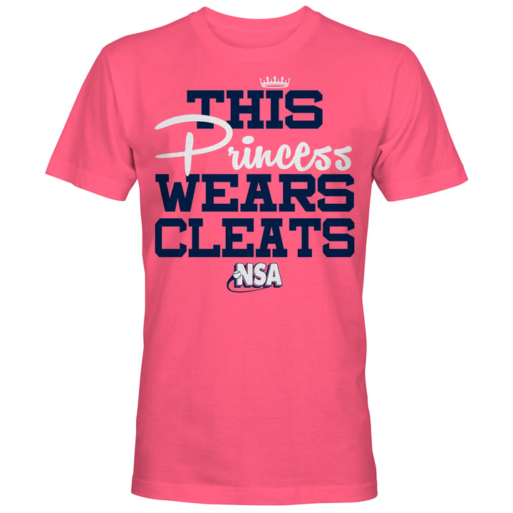 The DSG Apparel NSA This Princess Wears Cleats Short Sleeve Shirt features bold blue and white lettering with a crown above "Princess"—a perfect pink top for National Softball Association fans.