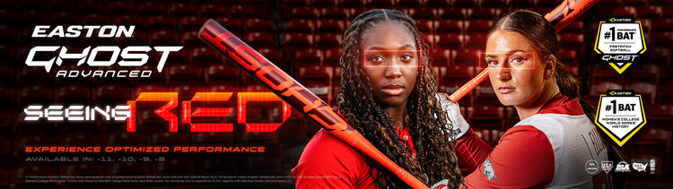 Two female softball players in red uniforms hold bats in a stadium. Bold text reads EASTON GHOST ADVANCED SEEING RED. Graphics highlight their eyes and bats, emphasizing performance and equipment.