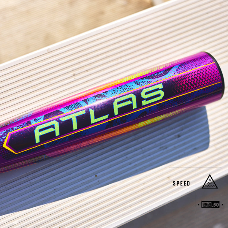 A vibrant, purple 2025 Louisville Slugger Atlas Neon Energy (-3) BBCOR Baseball Bat (WBL4164010) with ATLAS in bold yellow-green lies on a white slatted surface, featuring SPEED and BARREL .50 icons and an advanced EVOKE Alloy Barrel.
