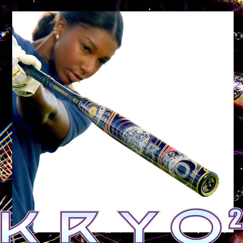 A person in a blue shirt holds out a detailed Louisville Slugger 2027 Louisville Slugger Kryo2 Empress Fastpitch Softball Bat, with “Kryo2 Empress” displayed boldly at the bottom.