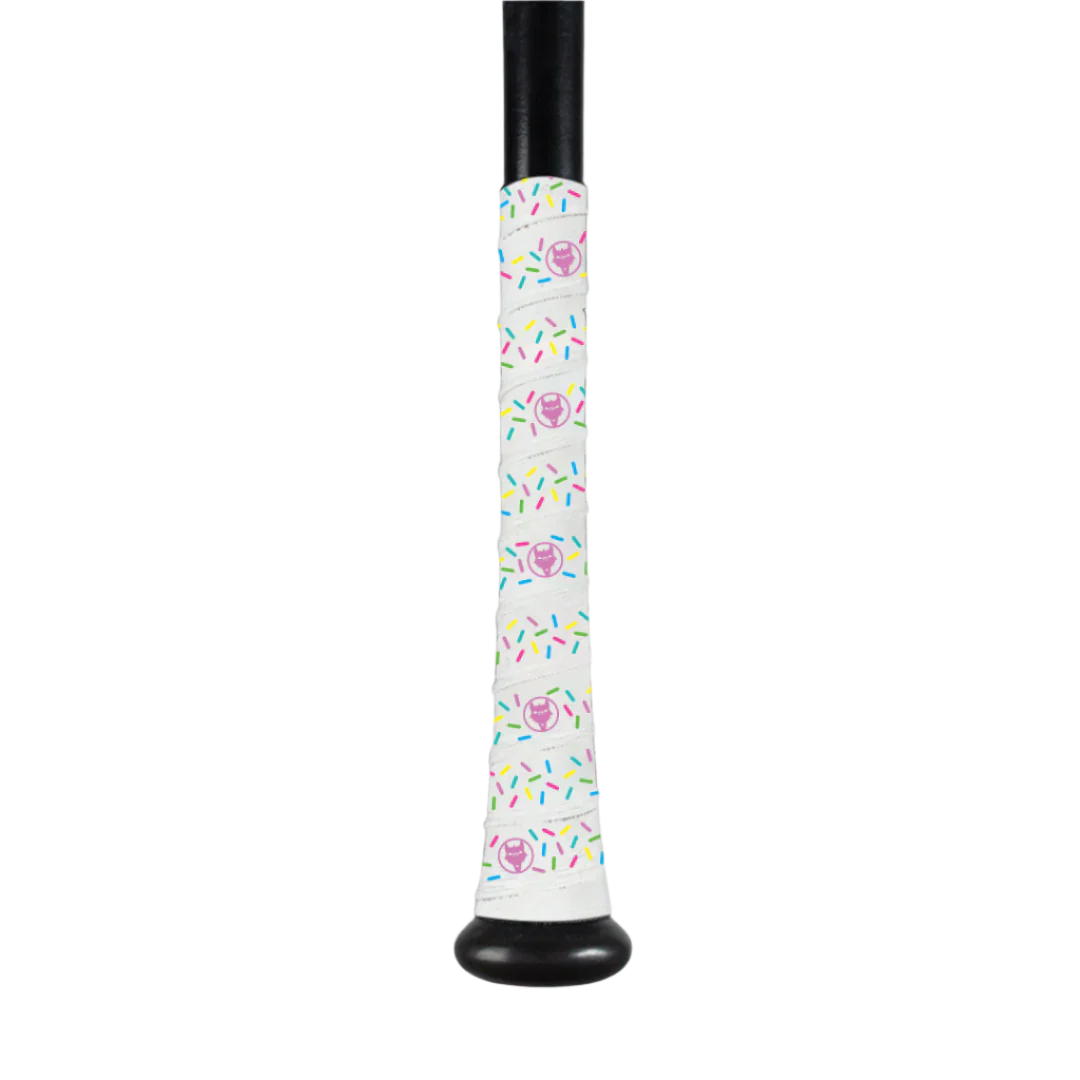 The VukGripz Bat Grip Tape by VukGripz features a black baseball bat handle wrap with a white background and pink frosted donuts with colorful sprinkles, providing optimum grip.